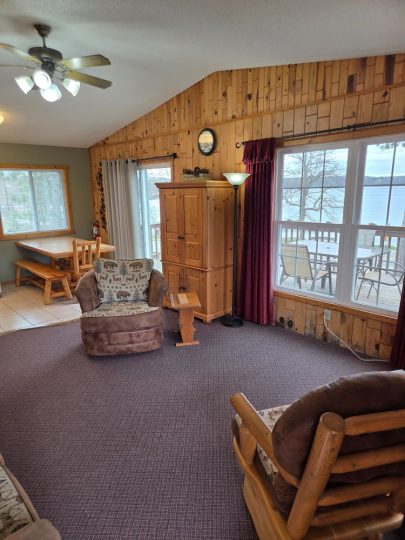 Cozy lakeside cabin living room with rustic wood decor